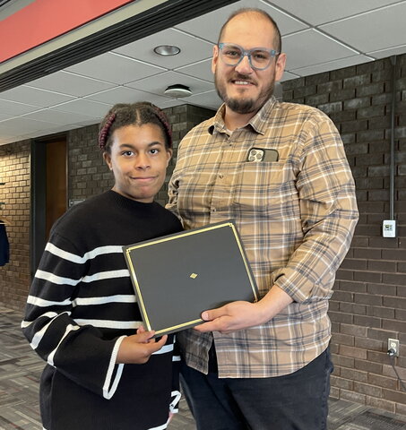 Trinity Mitchell accepts award