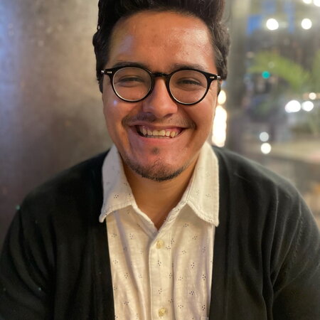 Image of Juan Mora smiling at the camera 