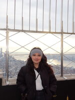 Kailey Reyes poses on top of the empire state building
